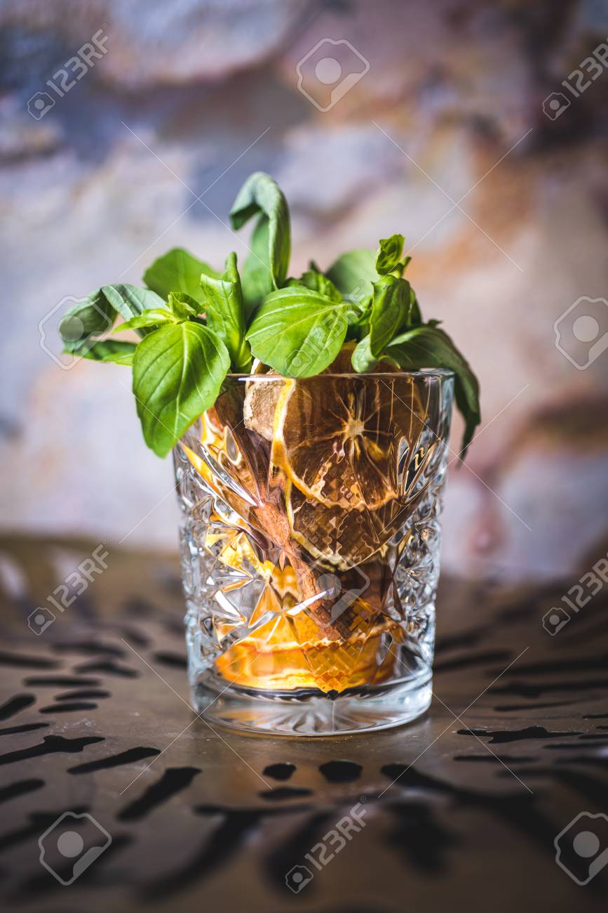 Lemon and mint in a glass with alcohol. - 99535105 Lemon and mint in a glass with alcohol. - 99535105