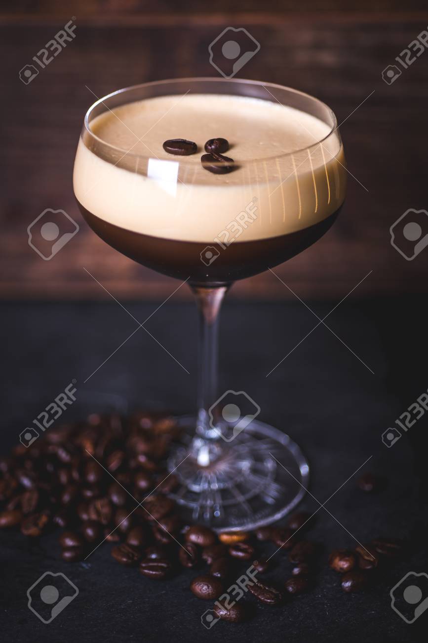 Coffee beans lie on the foam of the coffee cocktail. - 99535731 Coffee beans lie on the foam of the coffee cocktail. - 99535731