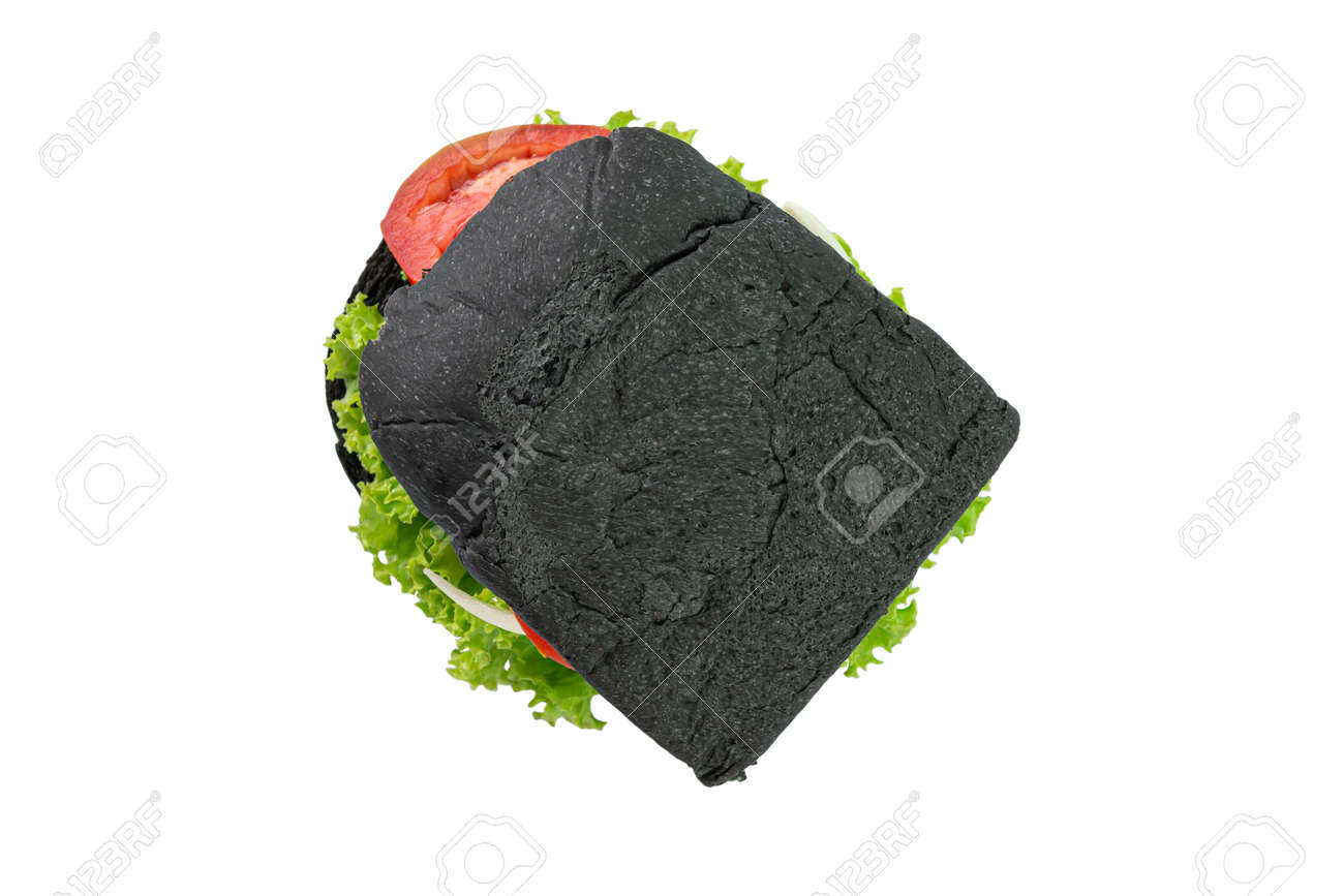 Homemade black bread sandwiches on a wooden kitchen board isolated on white background. Top view. - 166001305 Homemade black bread sandwiches on a wooden kitchen board isolated on white background. Top view. - 166001305