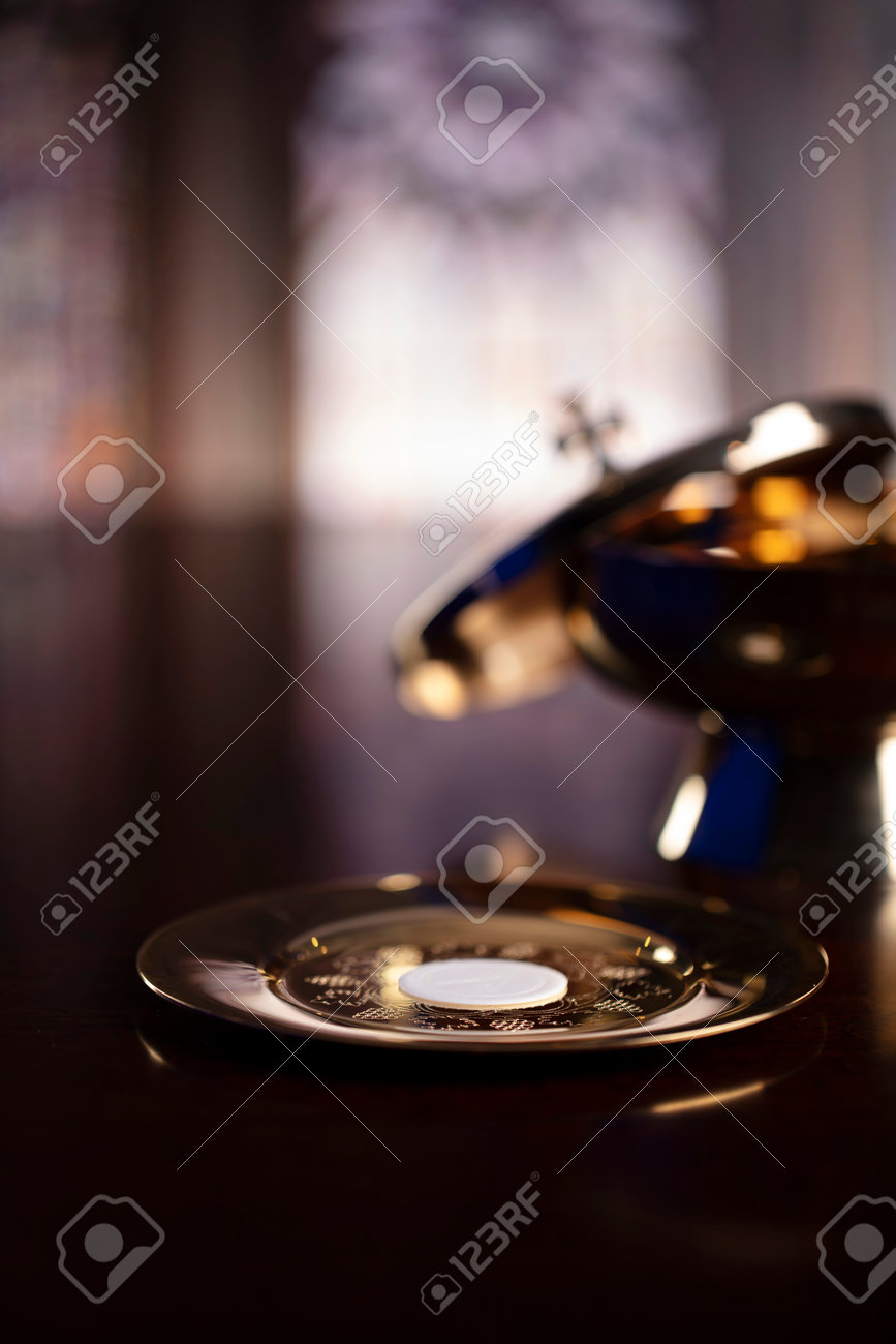 First Holy Communion. Catholic religion theme. Crucifix, the Croass and Golden chalice and wafer on the altar. - 168772310 First Holy Communion. Catholic religion theme. Crucifix, the Croass and Golden chalice and wafer on the altar. - 168772310