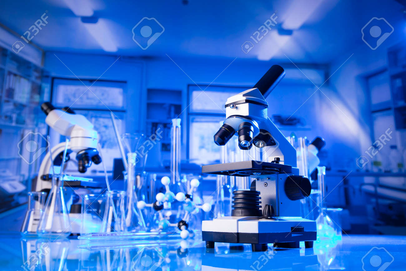 pandemic theme. Science research concerning fast tests and anti-vaccine. Microscope, beakers and test tubes in the scientific laboratory. - 169346736 pandemic theme. Science research concerning fast tests and anti-vaccine. Microscope, beakers and test tubes in the scientific laboratory. - 169346736