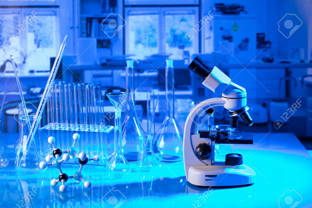 pandemic theme. Science research concerning fast tests and anti-vaccine. Microscope, beakers and test tubes in the scientific laboratory. - 169346737 pandemic theme. Science research concerning fast tests and anti-vaccine. Microscope, beakers and test tubes in the scientific laboratory. - 169346737