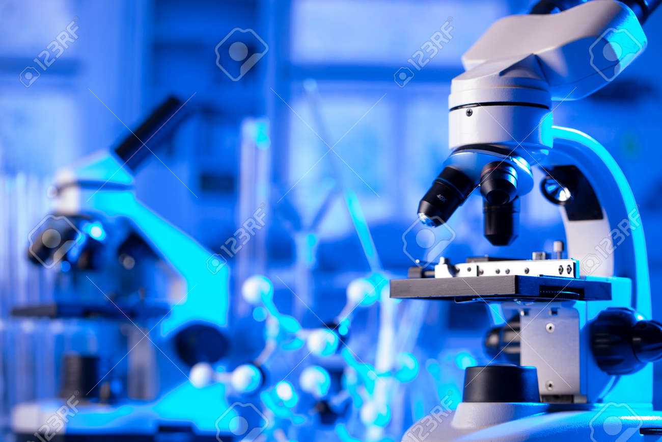virus pandemic theme. Science research concerning fast tests and anti-vaccine. Microscope, beakers and test tubes in the scientific laboratory. - 169346786 virus pandemic theme. Science research concerning fast tests and anti-vaccine. Microscope, beakers and test tubes in the scientific laboratory. - 169346786
