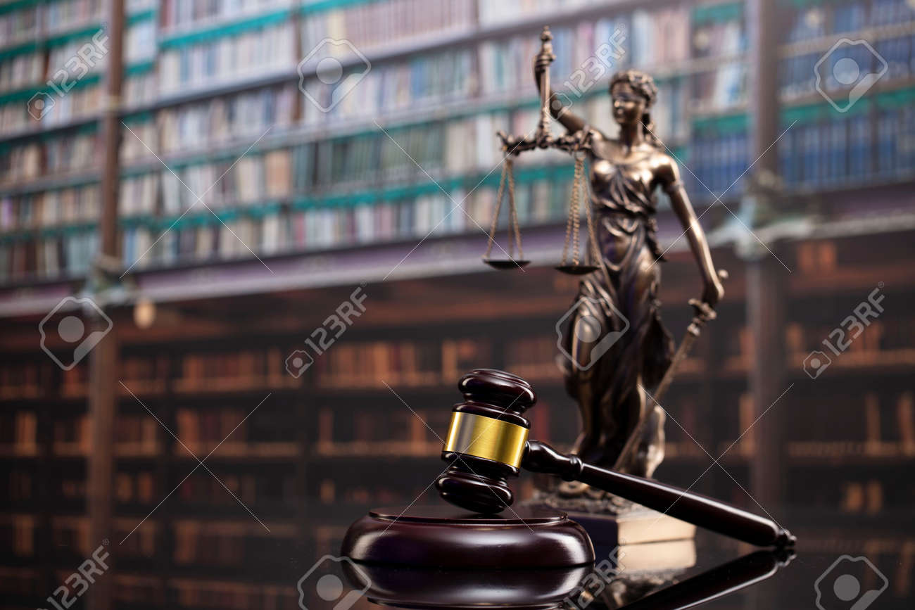 Law and justice concept. Gavel of the jugde, Themis sculpture and scale of justice in the court library. - 169346860 Law and justice concept. Gavel of the jugde, Themis sculpture and scale of justice in the court library. - 169346860