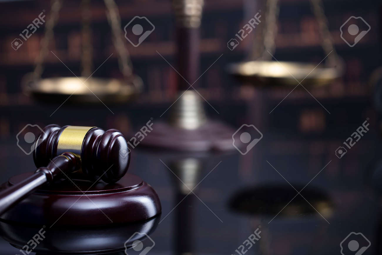 Law and justice concept. Gavel of the jugde, Themis sculpture and scale of justice in the court library. - 169346861 Law and justice concept. Gavel of the jugde, Themis sculpture and scale of justice in the court library. - 169346861