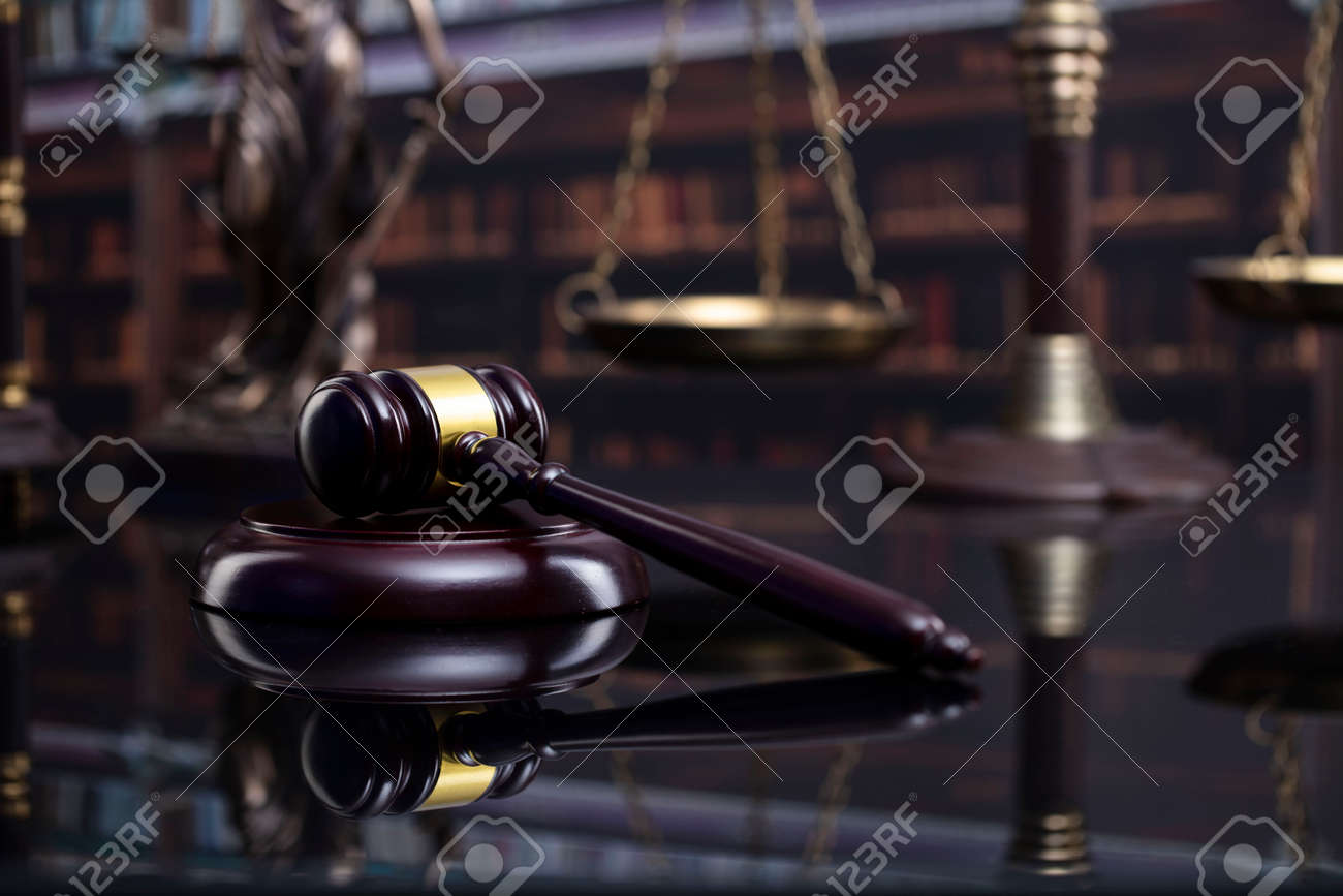 Law and justice concept. Gavel of the jugde, Themis sculpture and scale of justice in the court library. - 169346862 Law and justice concept. Gavel of the jugde, Themis sculpture and scale of justice in the court library. - 169346862