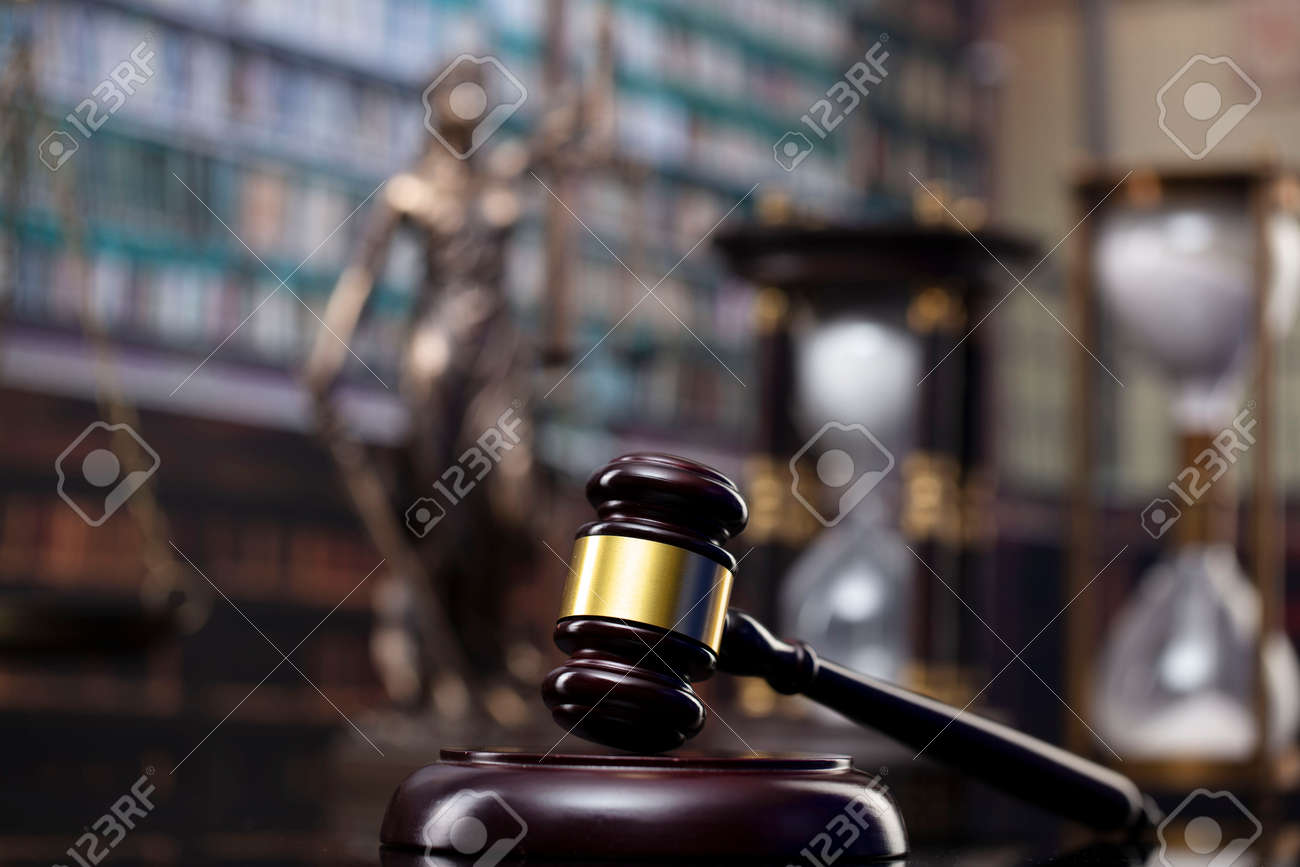 Law and justice concept. Gavel of the jugde, Themis sculpture and scale of justice in the court library. - 169346868 Law and justice concept. Gavel of the jugde, Themis sculpture and scale of justice in the court library. - 169346868