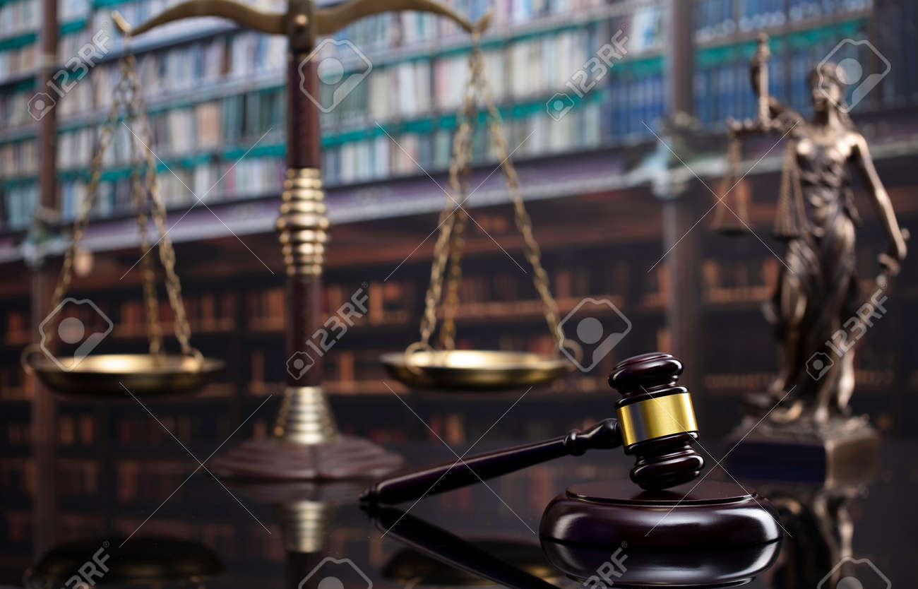 Law and justice concept. Gavel of the jugde, Themis sculpture and scale of justice in the court library. - 169346871 Law and justice concept. Gavel of the jugde, Themis sculpture and scale of justice in the court library. - 169346871