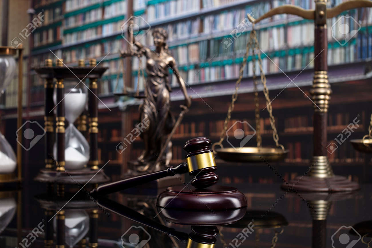Law and justice concept. Gavel of the jugde, Themis sculpture and scale of justice in the court library. - 169346872 Law and justice concept. Gavel of the jugde, Themis sculpture and scale of justice in the court library. - 169346872