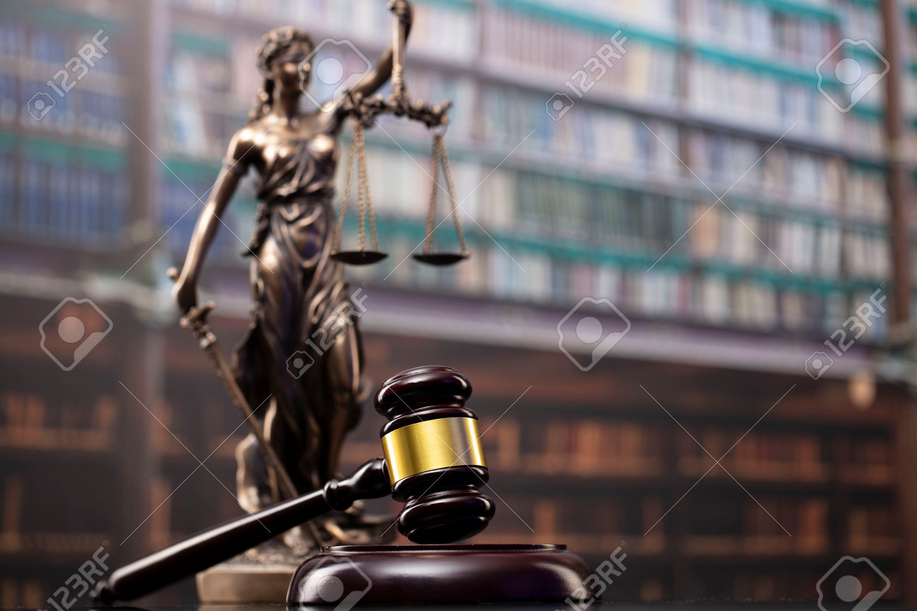 Law and justice concept. Gavel of the jugde, Themis sculpture and scale of justice in the court library. - 169346887 Law and justice concept. Gavel of the jugde, Themis sculpture and scale of justice in the court library. - 169346887