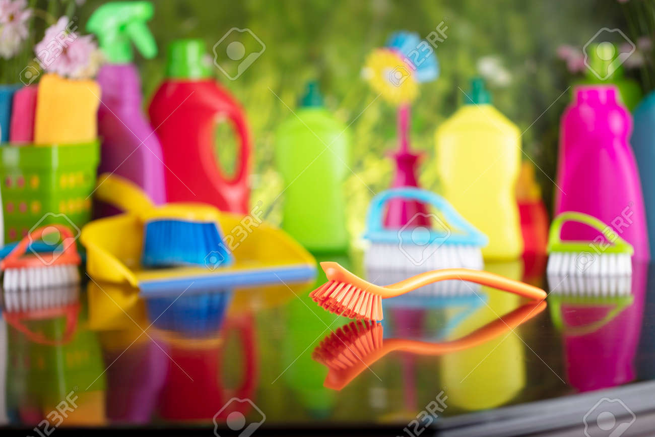 Spring house and office cleaning. Cleaning kit and sources on the glass table. Bokeh background. - 169346957 Spring house and office cleaning. Cleaning kit and sources on the glass table. Bokeh background. - 169346957