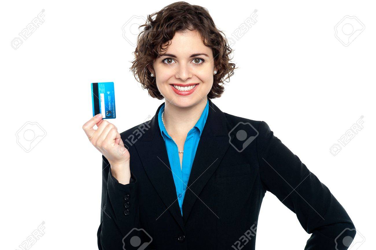 attractive woman holding up credit card to the camera business