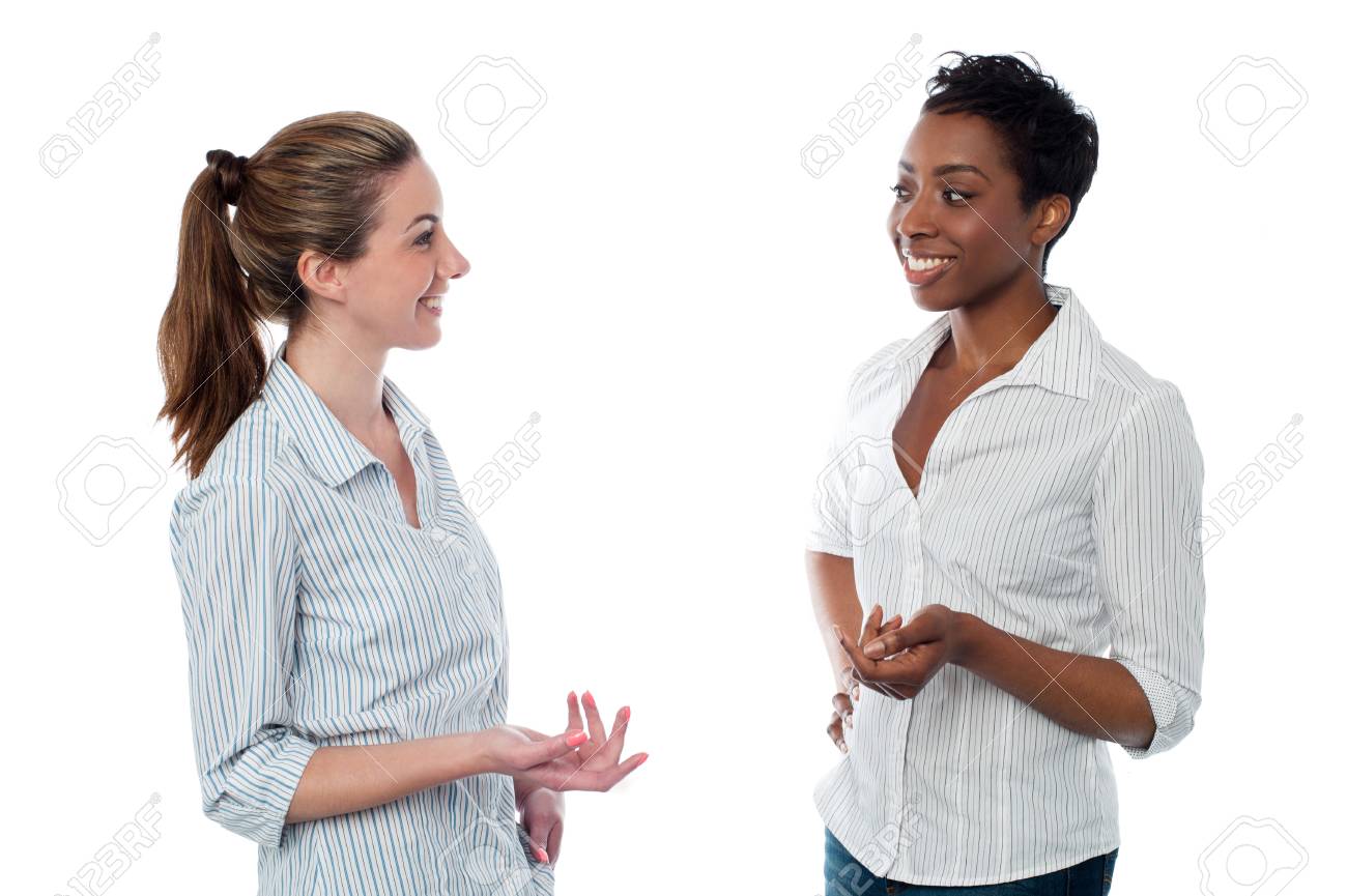 Women talking to each other, studio shot. - 54437890 Women talking to each other, studio shot. - 54437890