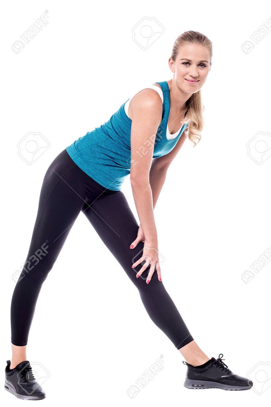 Beautiful woman bending and touching her knee. - 60379835 Beautiful woman bending and touching her knee. - 60379835
