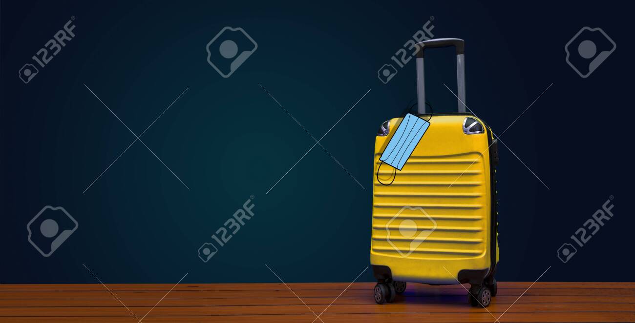 Download Yellow Travel Bag With Face Mask Hanging Stock Photo Picture And Royalty Free Image Image 146865662 PSD Mockup Templates