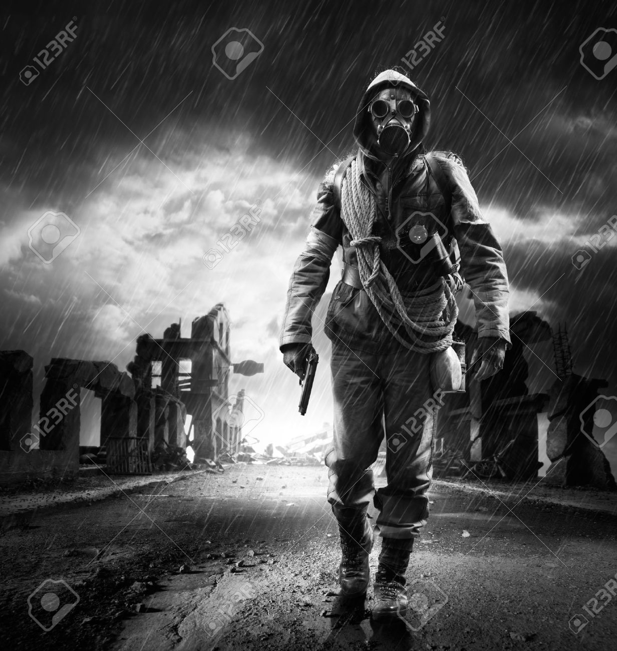 A lonely hero wearing gas mask walking through a city destroyed - 22809869 A lonely hero wearing gas mask walking through a city destroyed - 22809869