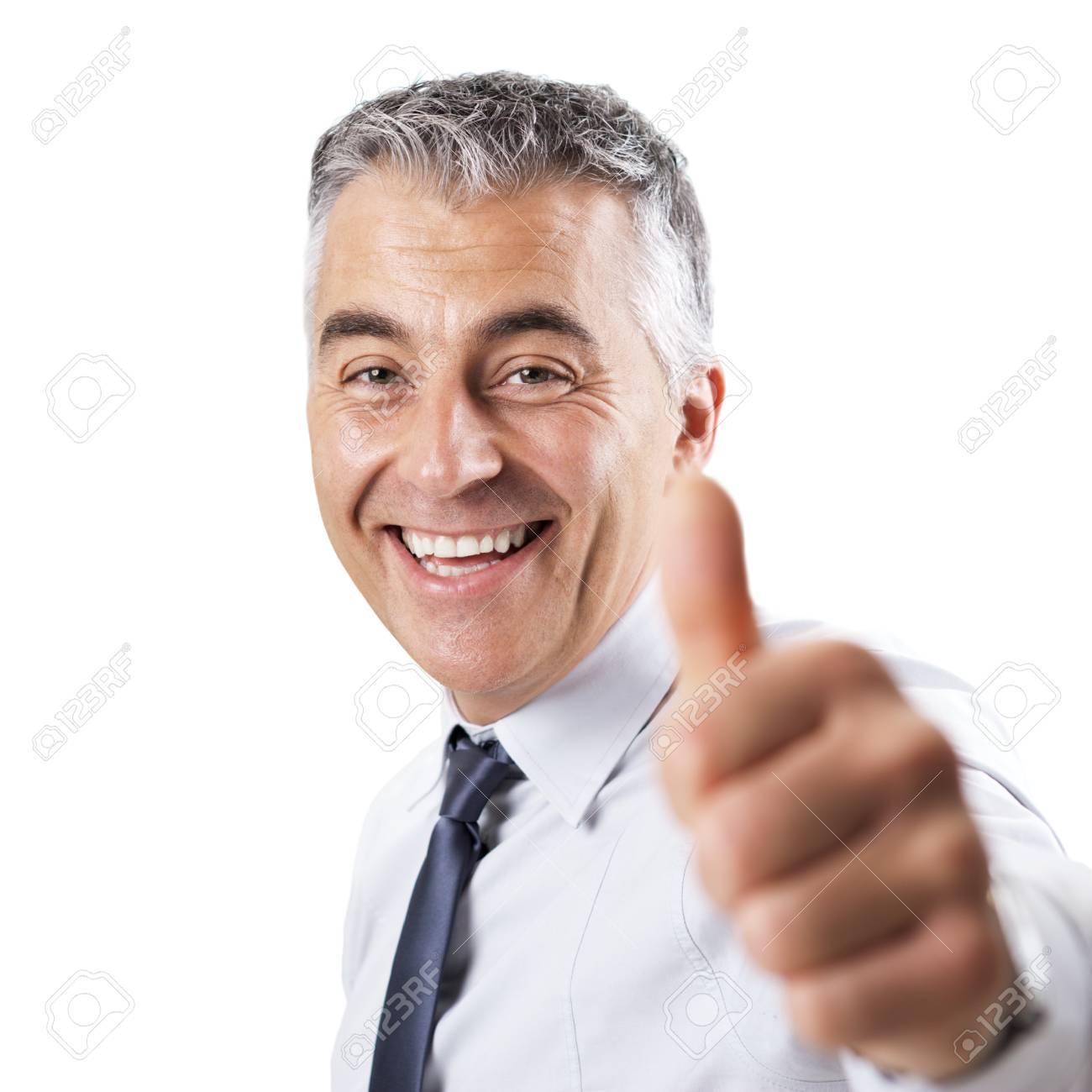 smiling confident businessman tumbs up on white background stock