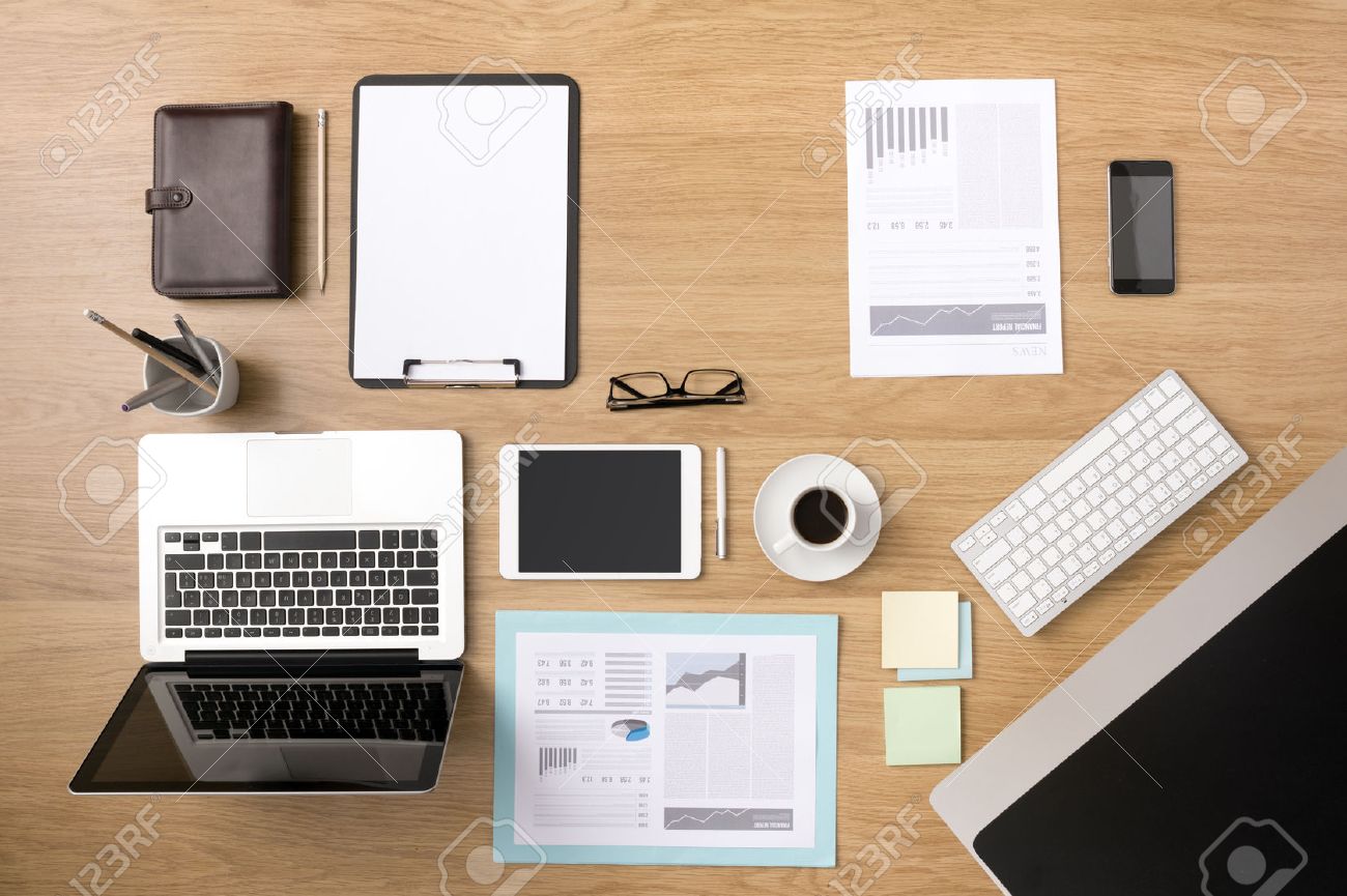businessman s tidy desktop and work tools with paperwork computer
