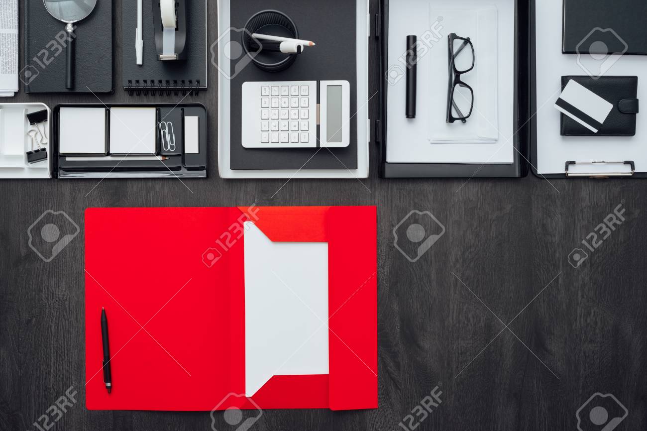 corporate business desktop with office accessories and open folder