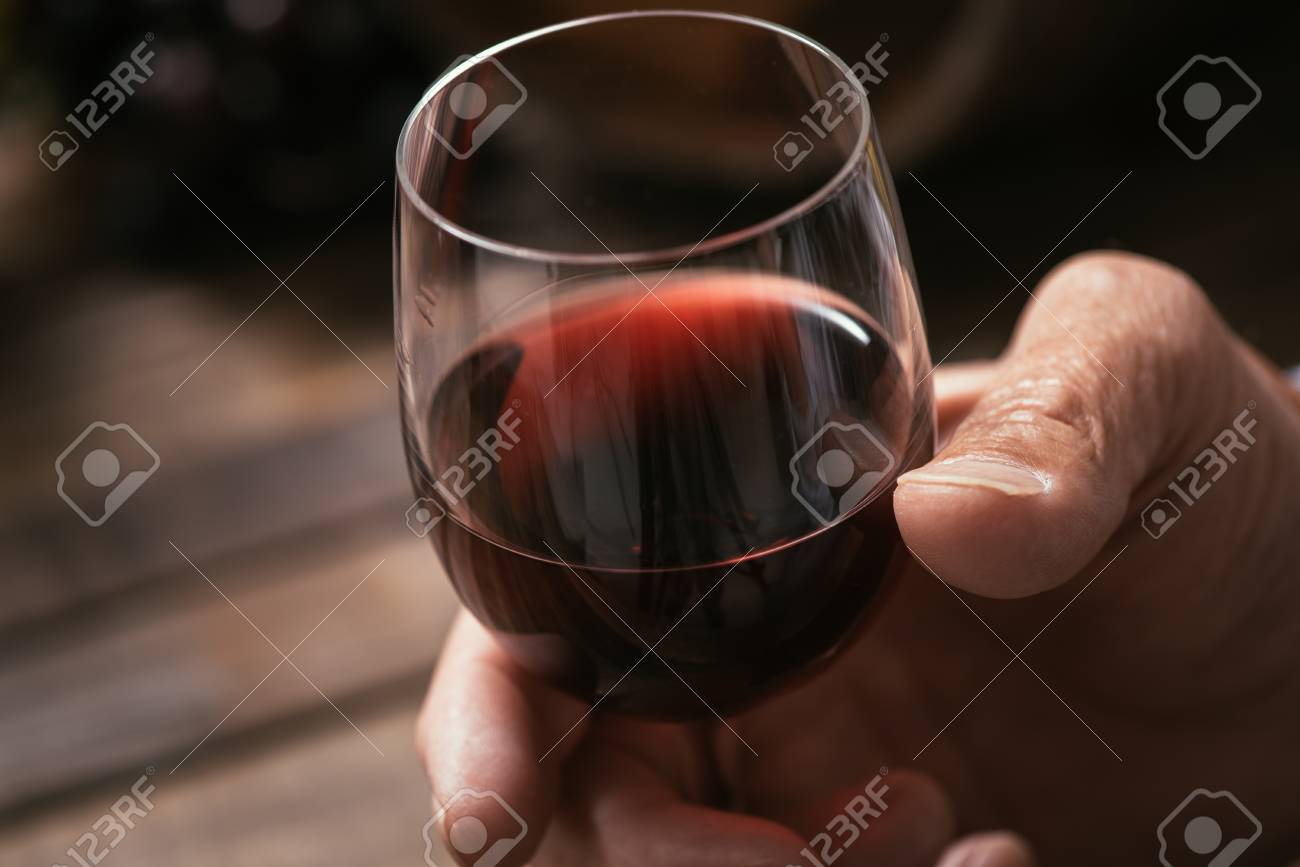 Senior Man Tasting A Glass Of Italian Red Wine Rustic Wooden