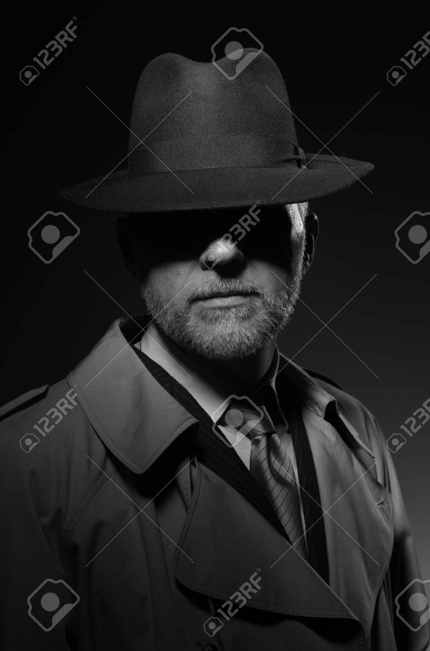 fedora hat and trench coat