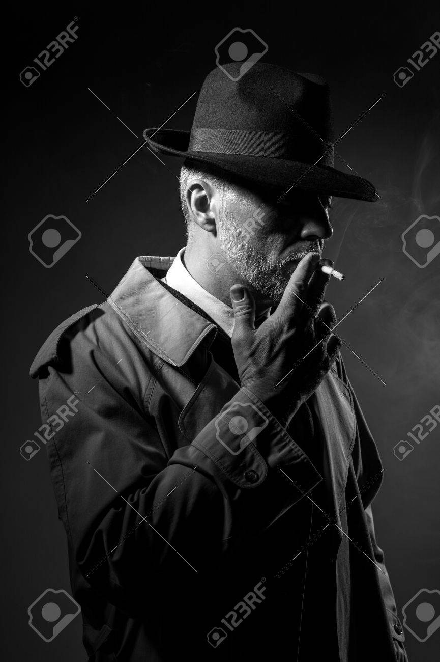 fedora hat and trench coat