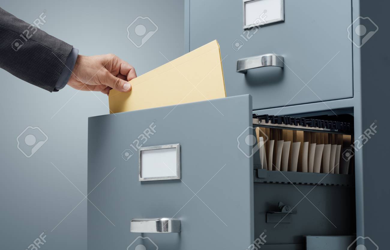 Office Clerk Searching Files In A Filing Cabinet Drawer Business Stock Photo Picture And Royalty Free Image Image 89418258