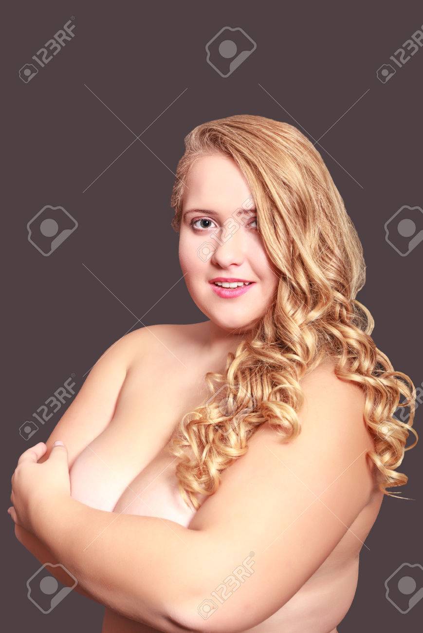 869px x 1300px - Young Chubby Smiling Woman With Long Curly Hair Covered Her Bare Breasts  With Your Arms Wide Stock Photo, Picture And Royalty Free Image. Image  48341797.