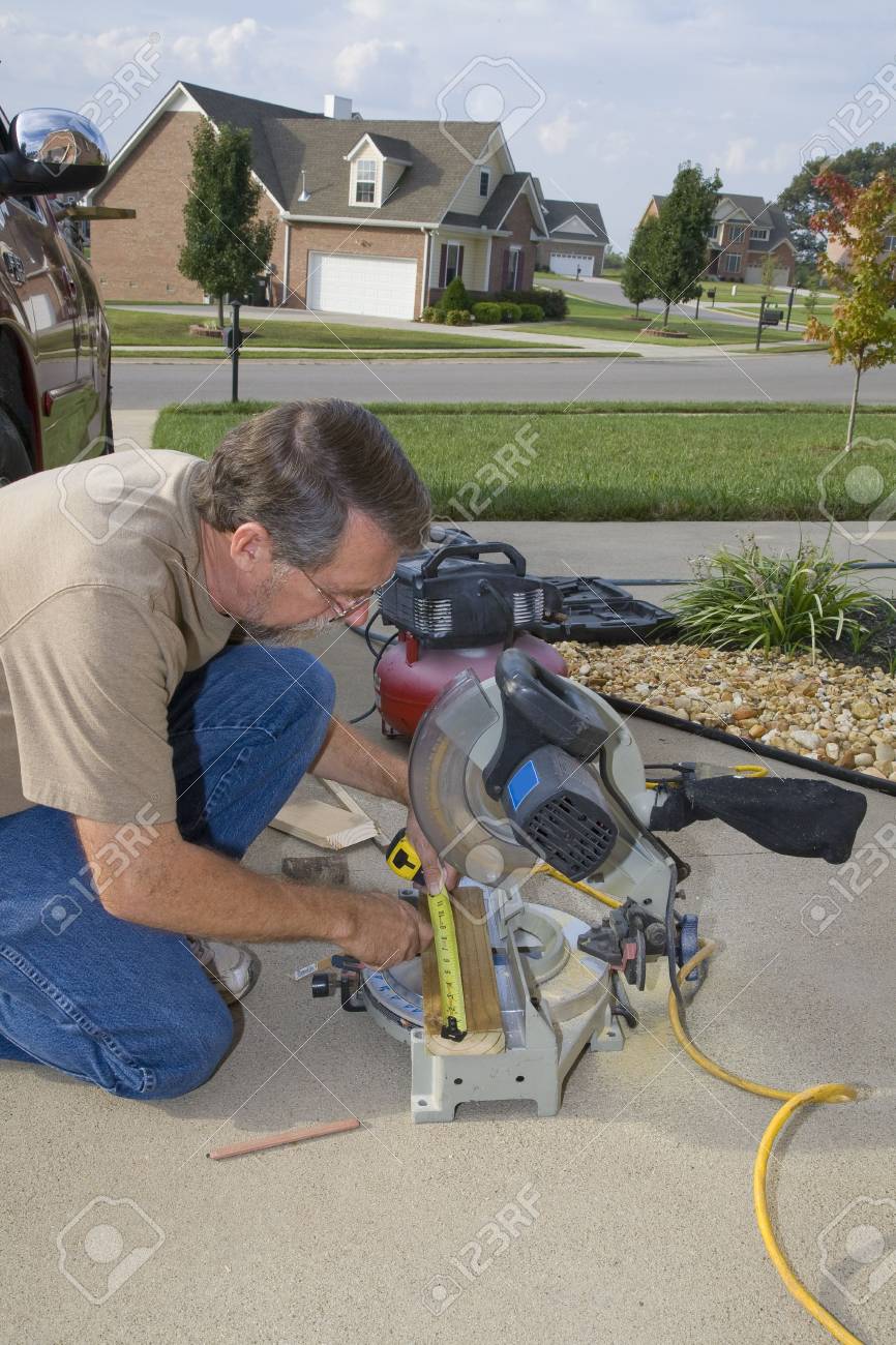 Carpenter Repairing Exterior Door Casing Weather Insects