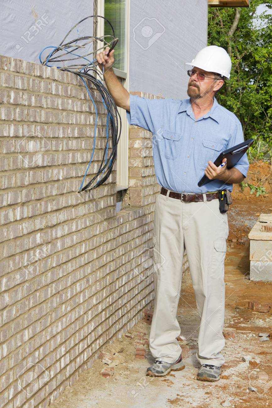 Building Inspector Checking Electrical Wiresphone Lines Building Framingelectrical And Plumbing Stub Building Inspector Checking Electrical Wiresphone Lines Building Framingelectrical And Plumbing Stub