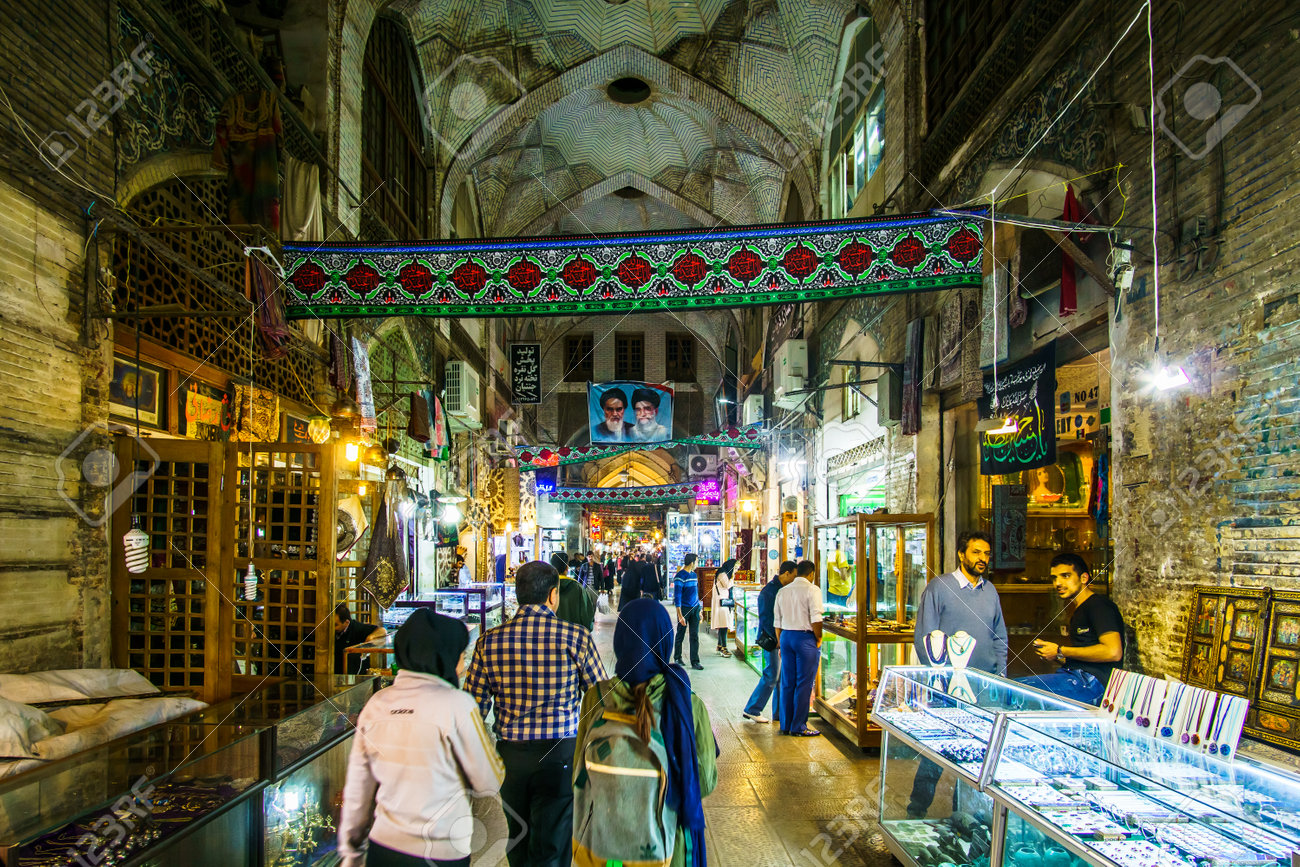 Isfahan, Iran on 31th October 2016: View on People looking onr local products in the Souk of the old town - 142308225 Isfahan, Iran on 31th October 2016: View on People looking onr local products in the Souk of the old town - 142308225