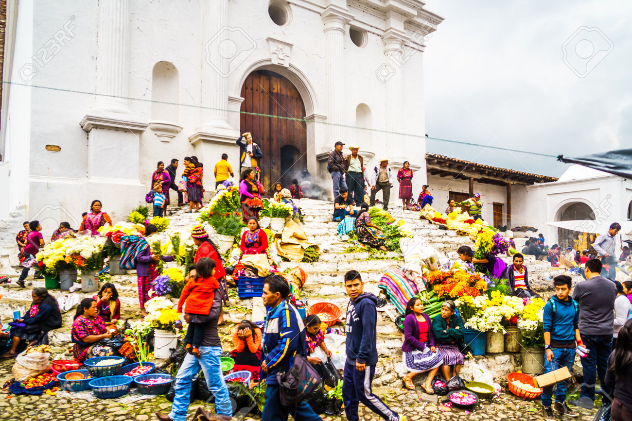 Chichicastenango, Guatemala on 2th May 2016: View on group of indigenous people selling products in front of church - 142308253 Chichicastenango, Guatemala on 2th May 2016: View on group of indigenous people selling products in front of church - 142308253
