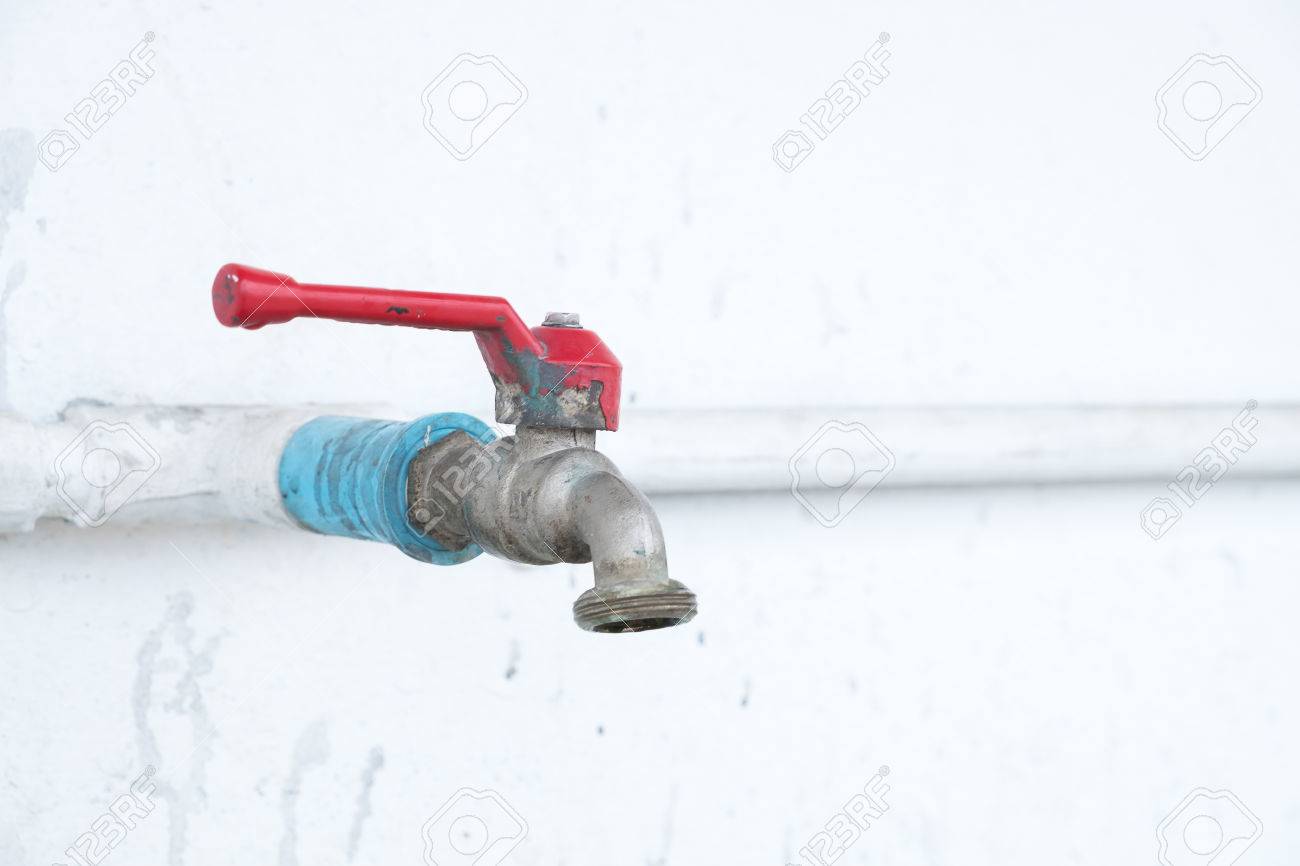 Red Faucet Handle Puller And Faucet Pipe Selective Focus Stock