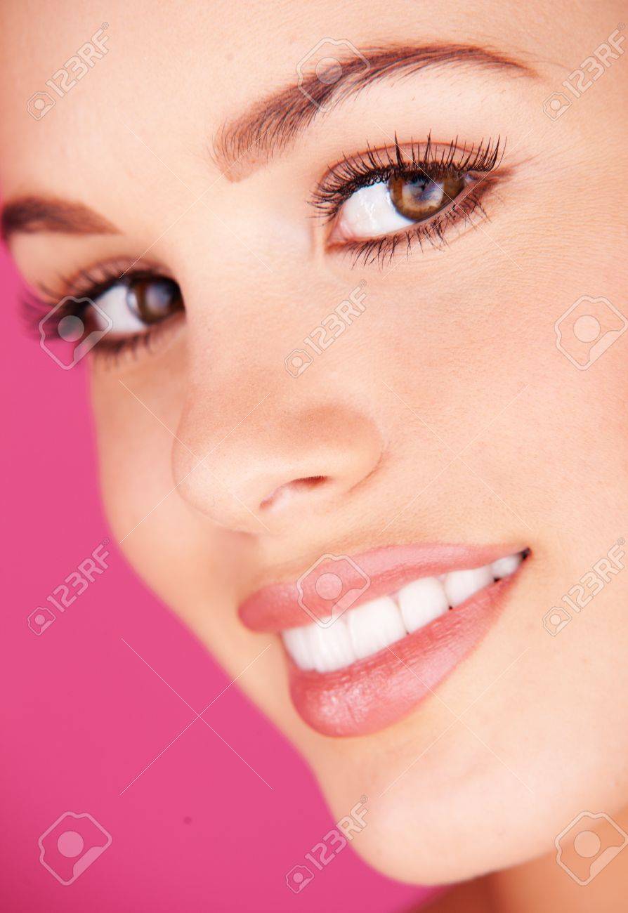 woman portrait with a white healthy teeth on pink background - 12587849 woman portrait with a white healthy teeth on pink background - 12587849