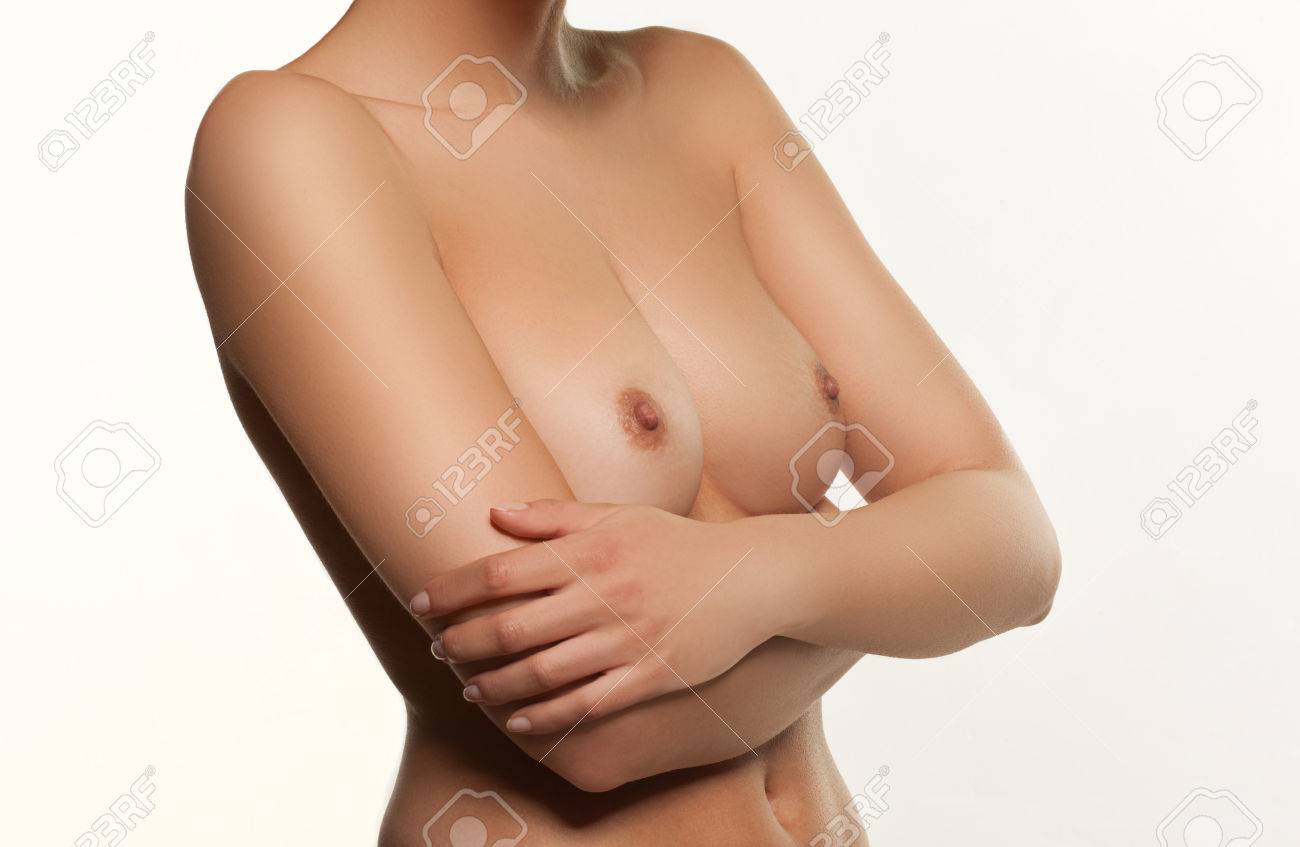 Closeup Of The Bare Breasts And Nipples Of A Young Woman Turned At An Angle  To The Camera, Isolated On White Stock Photo, Picture and Royalty Free  Image. Image 25730372.