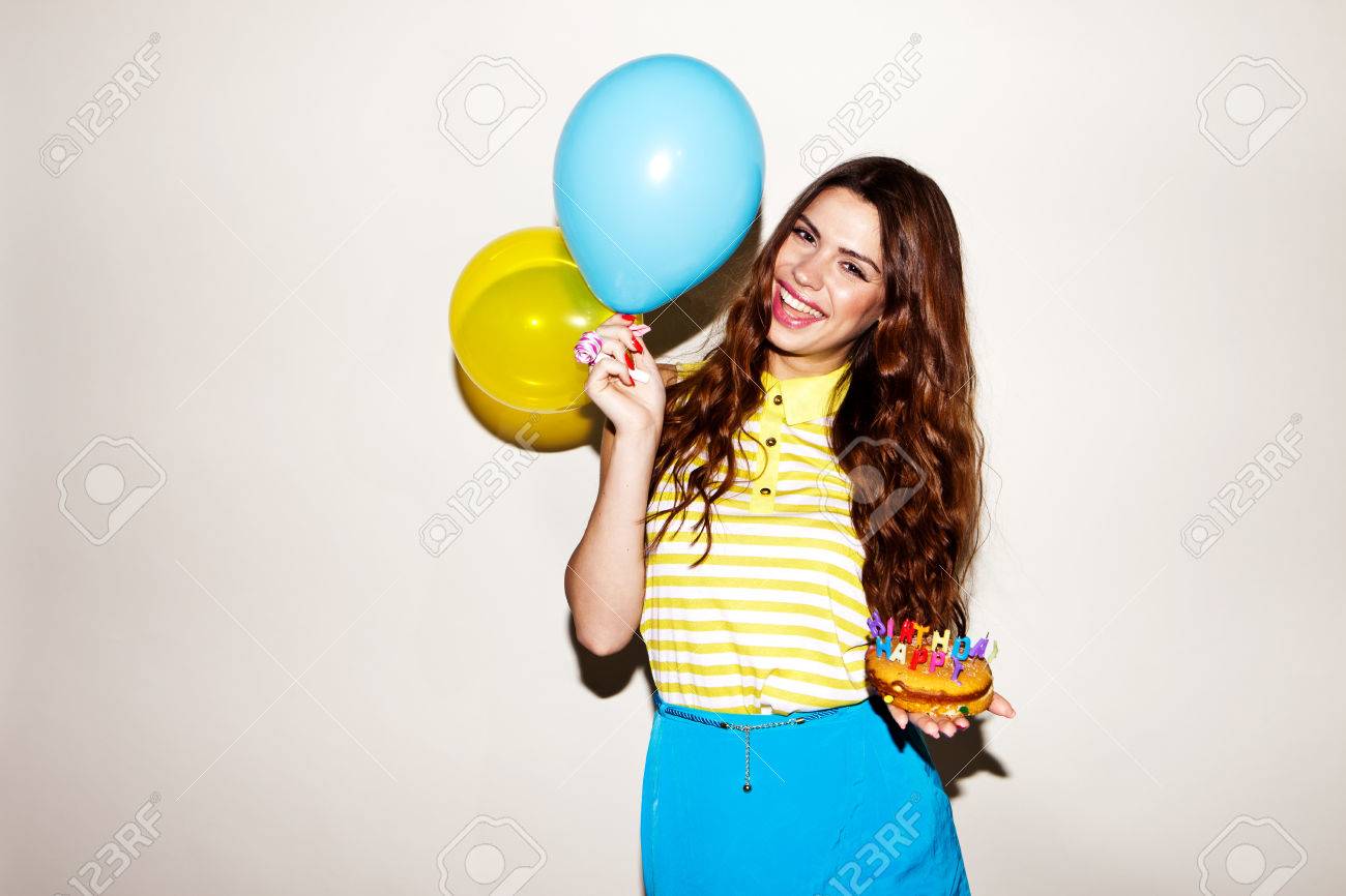 happy brunette woman celebreting her birthday with the cake and ballons - 54885008 happy brunette woman celebreting her birthday with the cake and ballons - 54885008