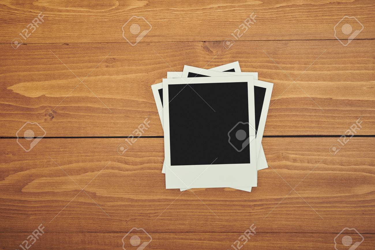 old polaroid film with frame on wood table stock photo picture and