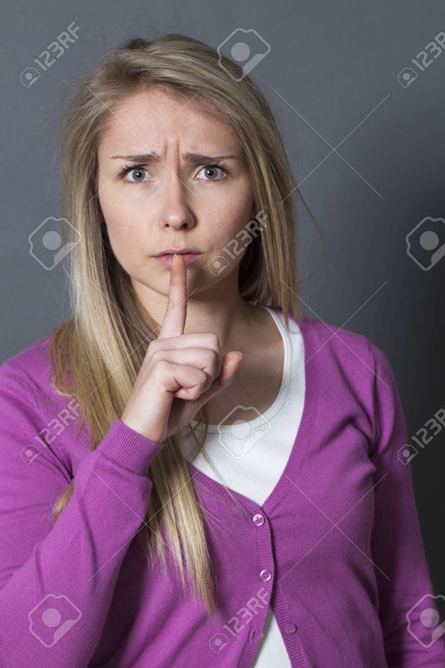 Secret And Taboo Concept Bothered Young Blond Girl Wearing Purple Sweater Asking For Silence With Secret And Taboo Concept Bothered Young Blond Girl Wearing Purple Sweater Asking For Silence With