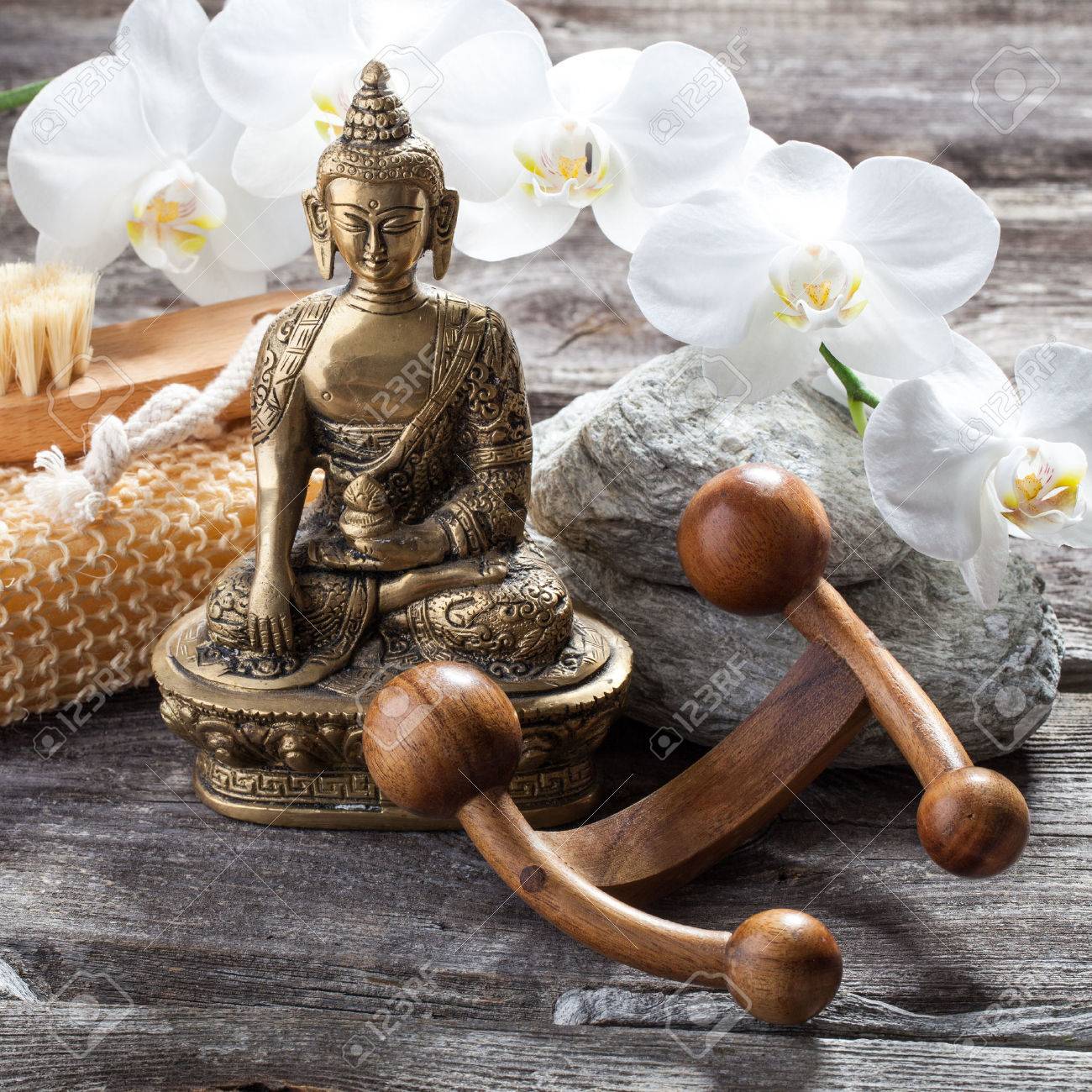 Spa Beauty Treatment Concept - Symbol Of Massage And Peeling For Inner  Beauty With Buddha On Old Wood, Gray Texture Stones And White Orchid Flower  Background For Genuine Feng Shui Decor Stock, image size:1300x1300