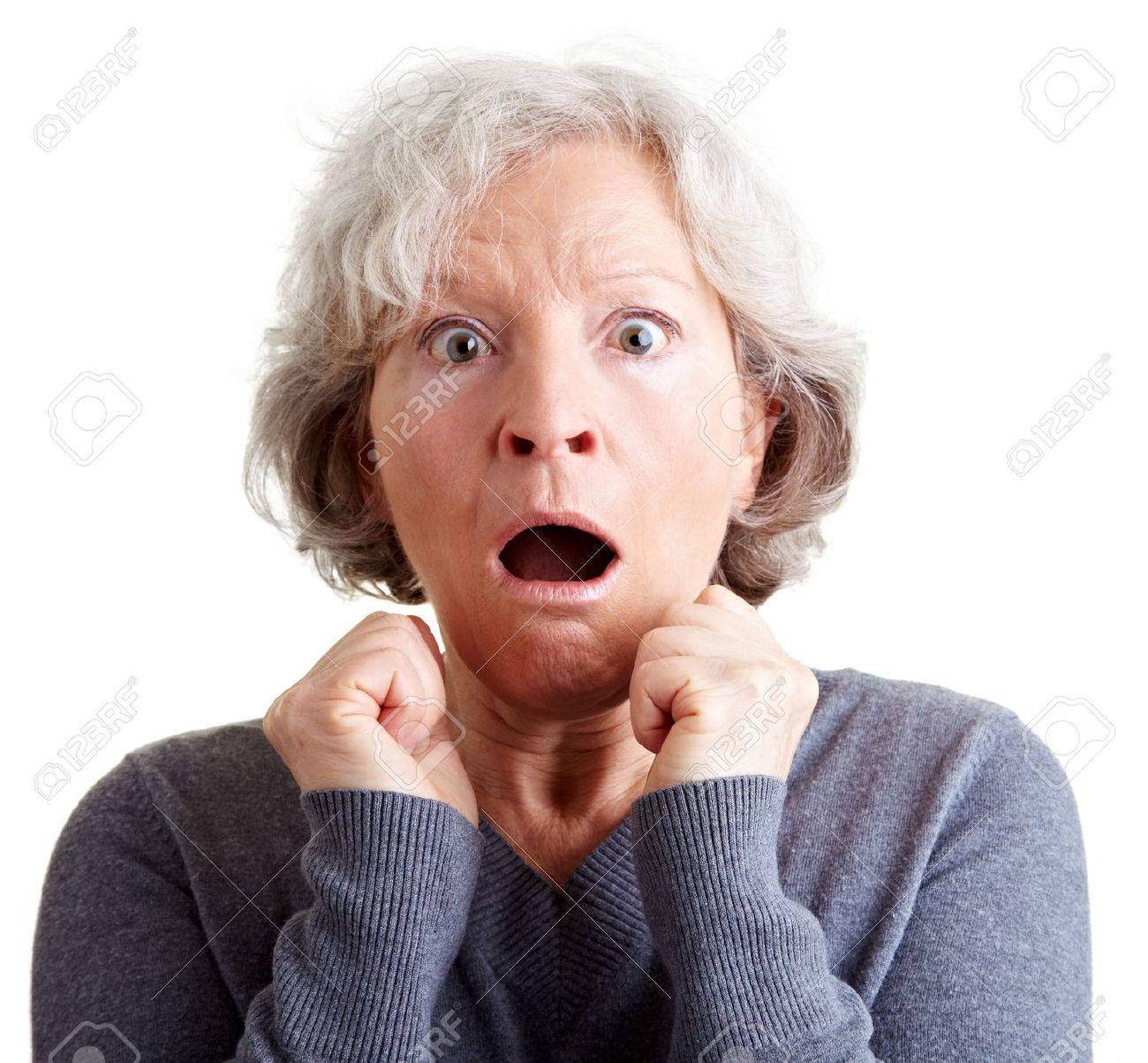 Frightened elderly woman looking surprised and shocked - 9108672 Frightened elderly woman looking surprised and shocked - 9108672