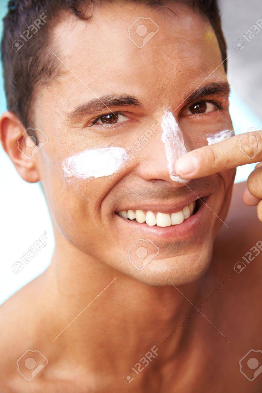 putting lotion on face