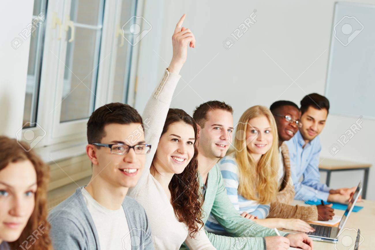 Young Smiling Woman Raising Her Hand In A University Class Stock Photo,  Picture and Royalty Free Image. Image 18385143., image size:1300x866