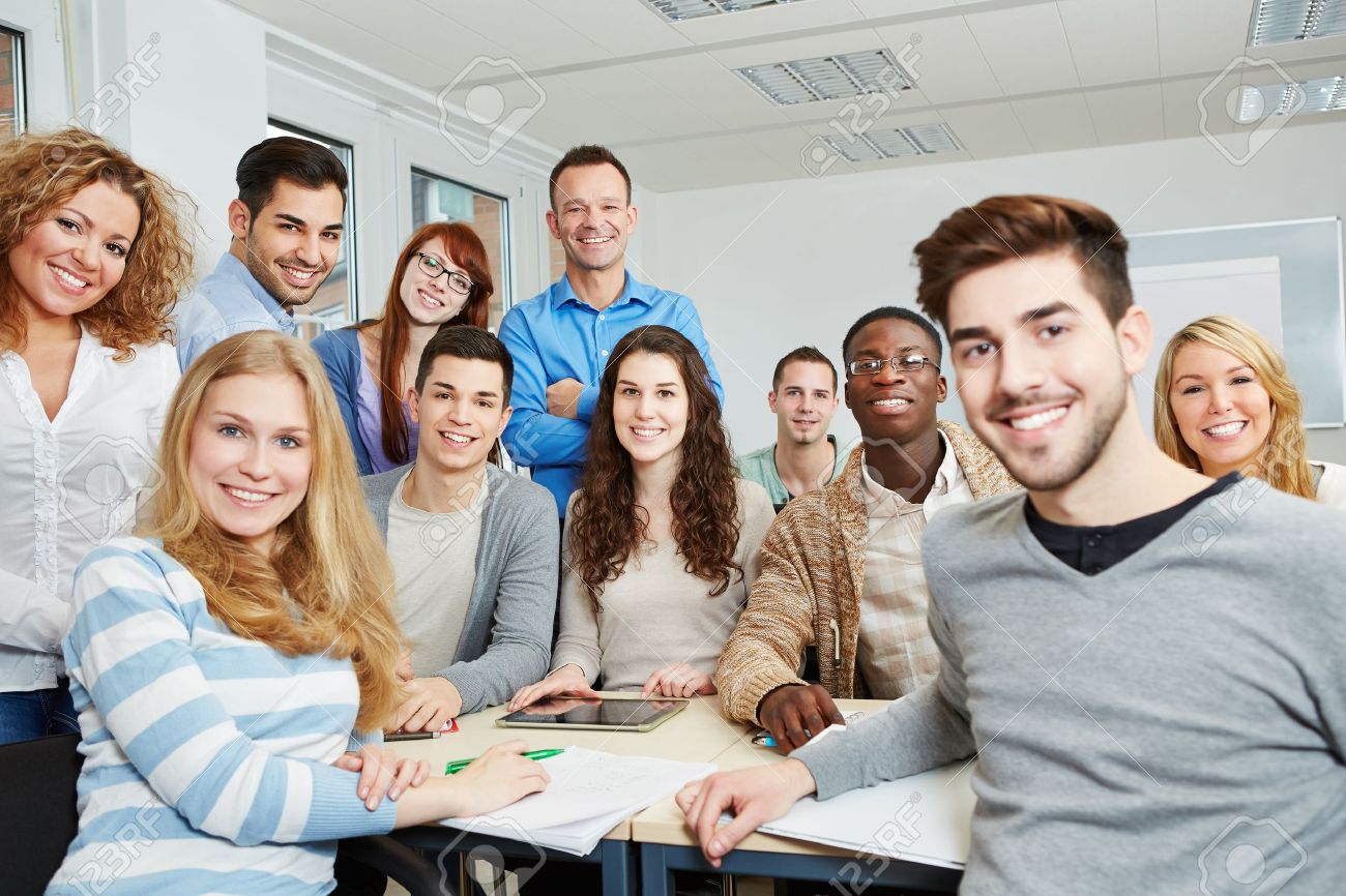 Làm sao để giữ động lực học tiếng Anh khi bạn quá bận rộn? 2 Group Of Happy Students With Teacher And Tablet Computer In Class Stock Photo, Picture And Royalty Free Image. Image 18629475.