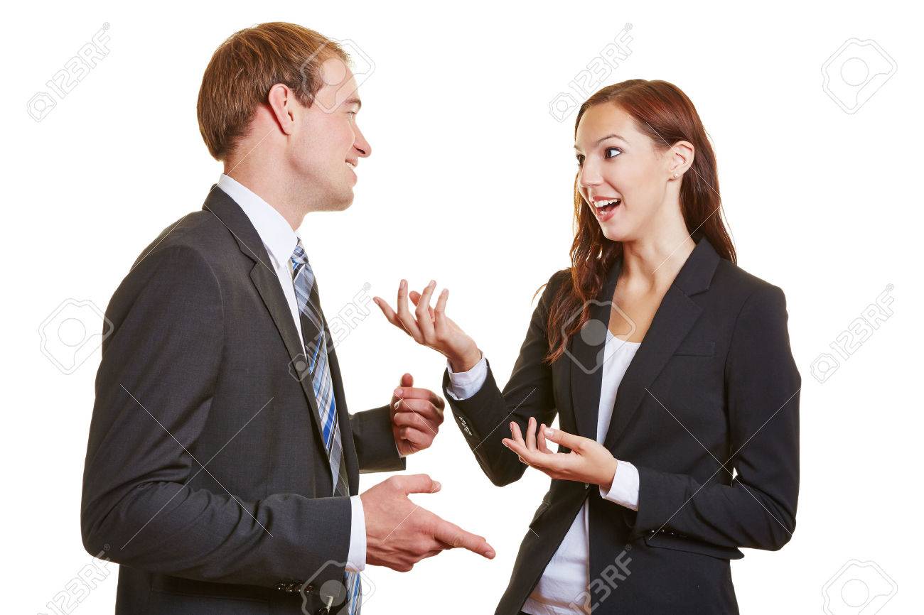 two business people talking engaged to each other and using their