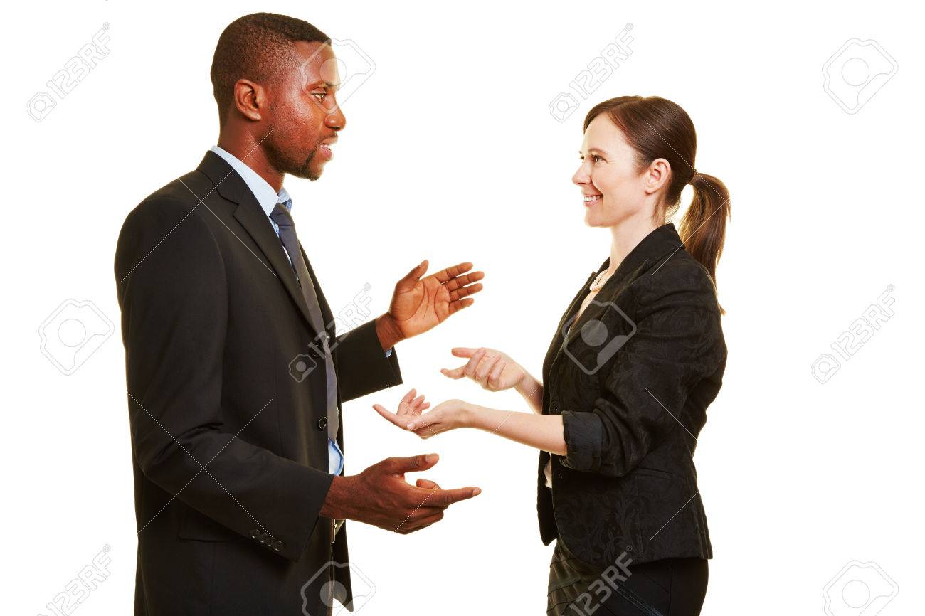 two business people talking to each other and negotiating stock