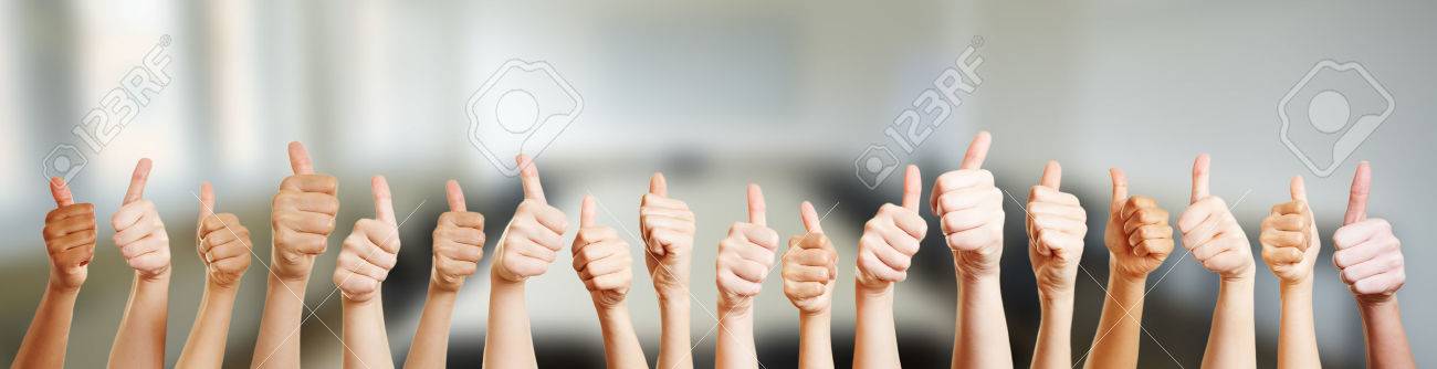 Many hands holding thumbs up in office - 62477786 Many hands holding thumbs up in office - 62477786