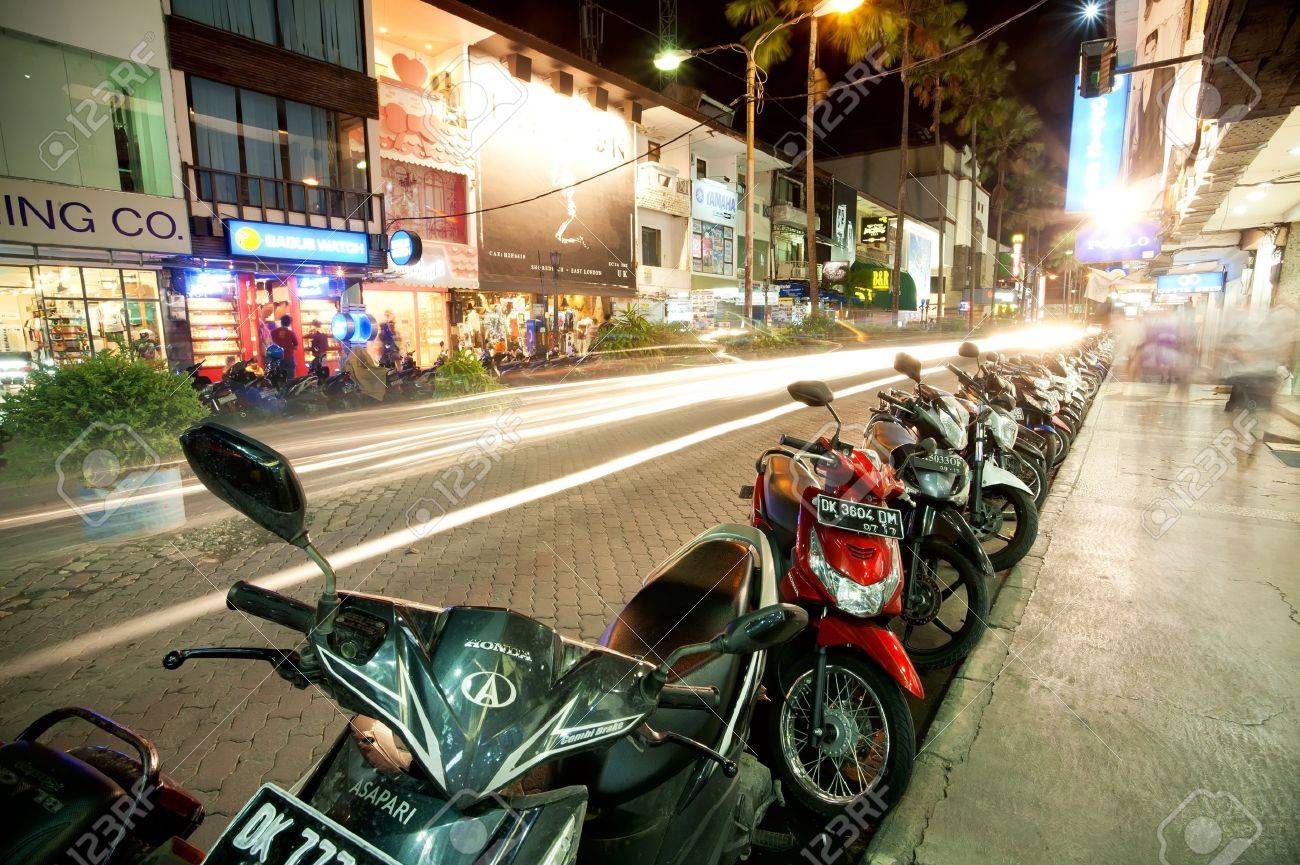 BALI - DECEMBER 27: Nighttime, mopeds stays in the parking at the shopping street, Kuta's area on December 27, 2012 in Bali, Indonesia. Kuta is known internationally for its long sandy beach, varied accommodation, many restaurants and bars. - 19739305 BALI - DECEMBER 27: Nighttime, mopeds stays in the parking at the shopping street, Kuta's area on December 27, 2012 in Bali, Indonesia. Kuta is known internationally for its long sandy beach, varied accommodation, many restaurants and bars. - 19739305