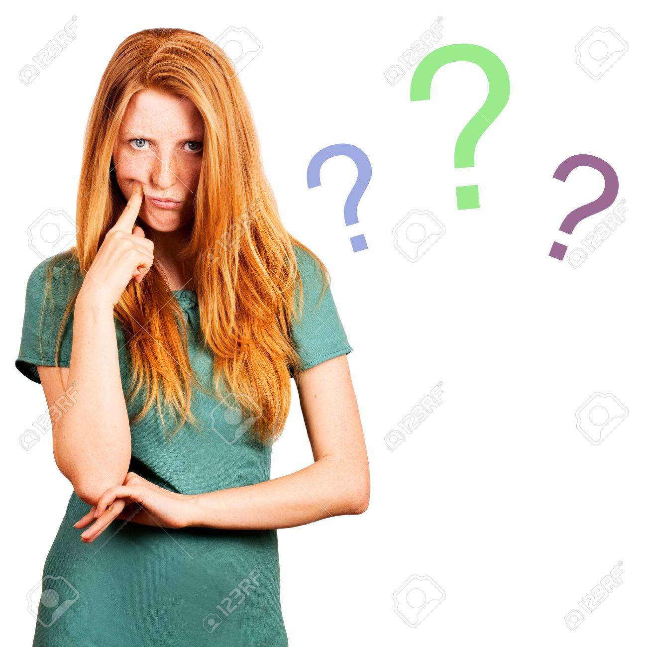 thinking red-haired girl isolated on a white, questions marks at background - 19786511 thinking red-haired girl isolated on a white, questions marks at background - 19786511