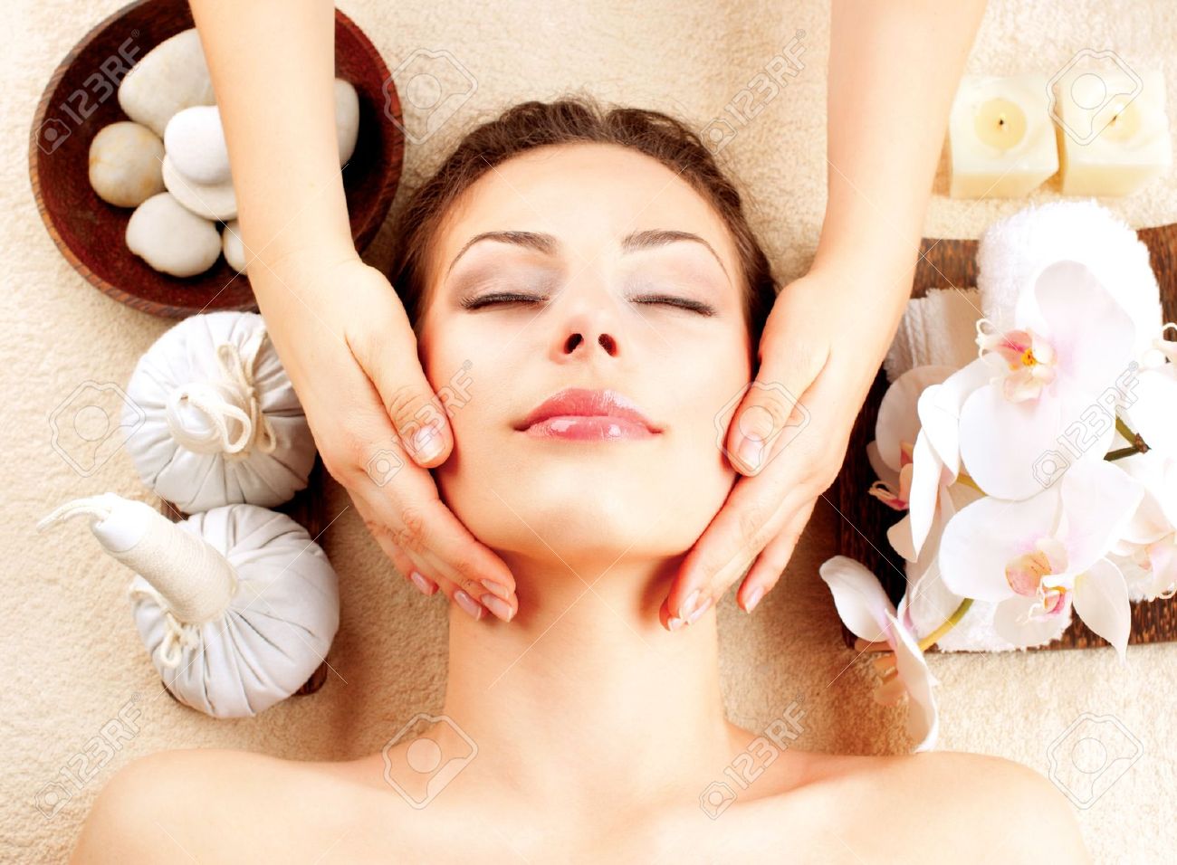 Spa Massage Young Woman Getting Facial Massage Stock Photo, Picture And Royalty Free Image. Image 17416397.