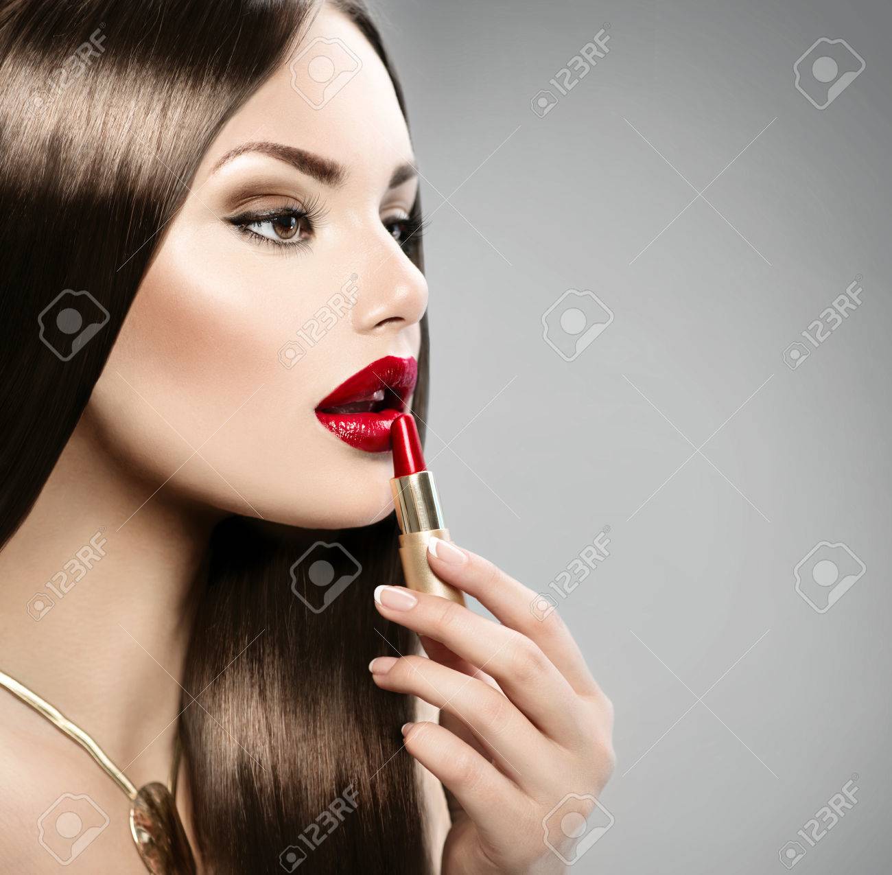 Sexy Girl Applying Makeup Red Lipstick 